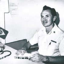 Dr Martin Shearn sitting at a desk.